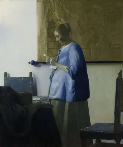 Woman in Blue Reading a Letter — Johannes Vermeer